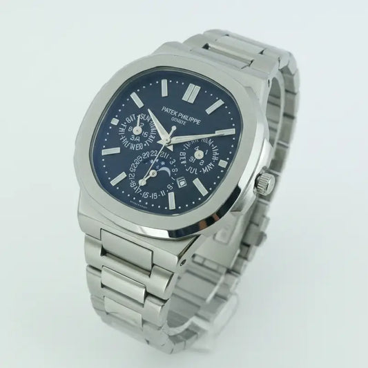 Silver Patek Philippe watch with a blue face on a light gray background