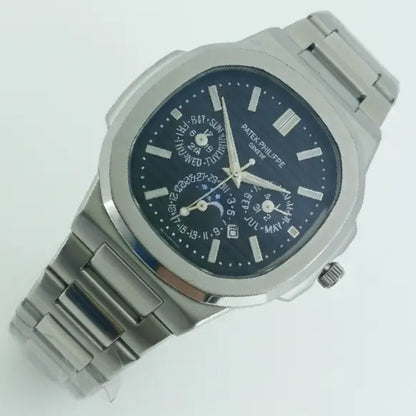Silver Patek Philippe watch with a blue face on a white background