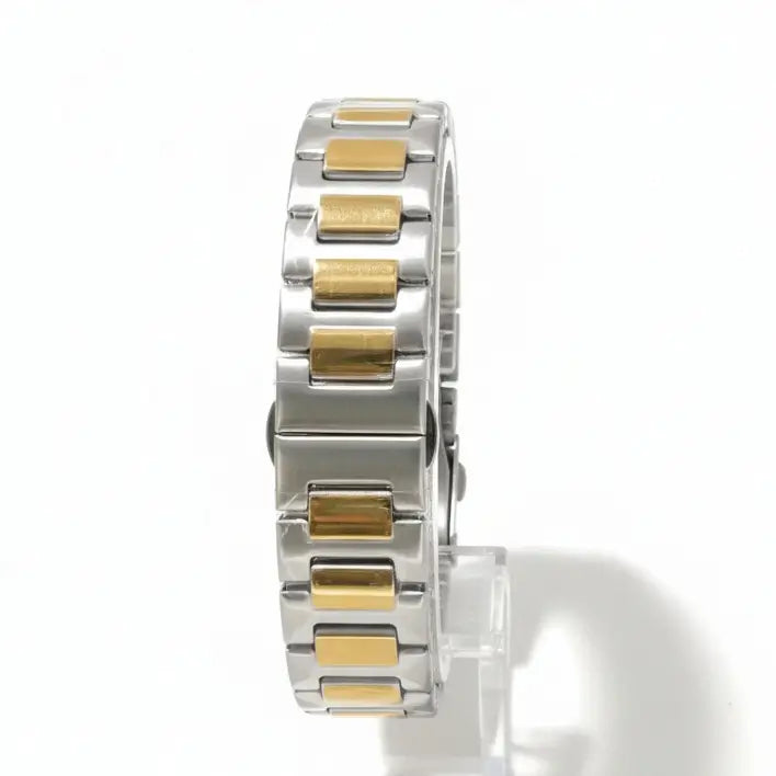 Silver and gold bracelet on a white background