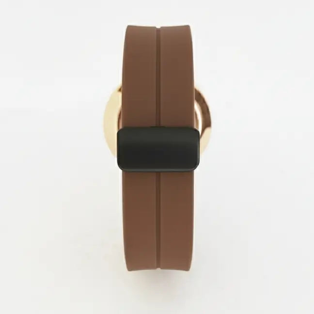 Brown watch strap with gold clasp on a white background